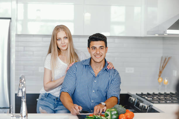 istock couple at home in a kitchen 1049119110