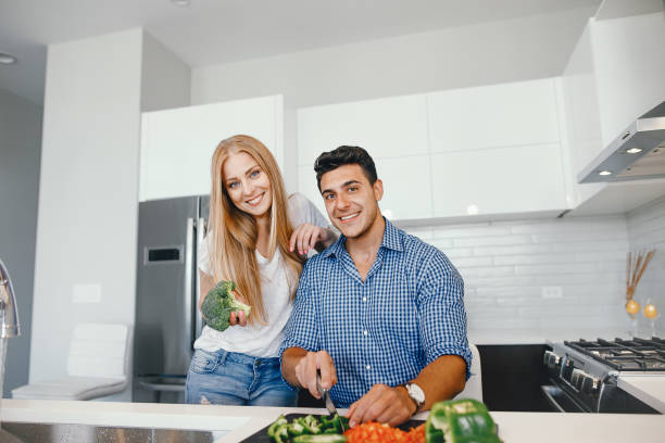 istock couple at home in a kitchen 1049119850