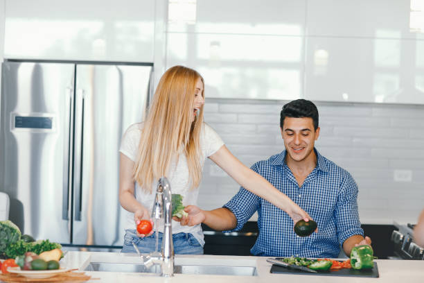 istock couple at home in a kitchen 1049120256