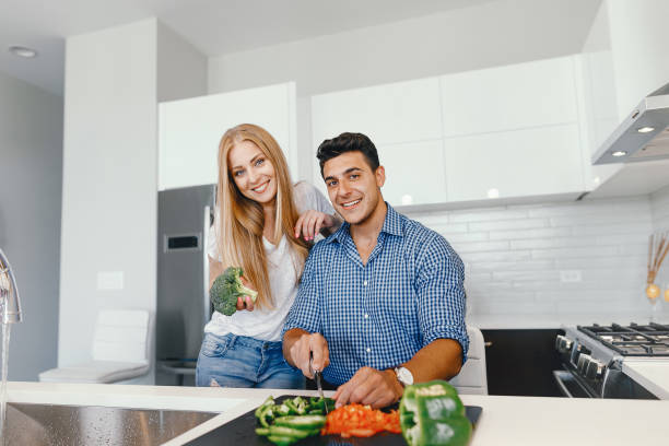 istock couple at home in a kitchen 1049120262