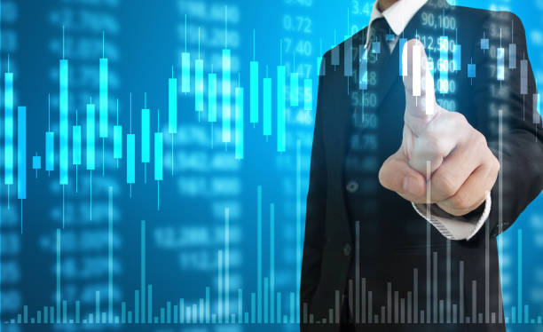 istock hand with stock financial chart symbols coming from hand 1049123180