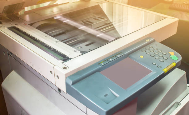 istock photocopier with  luminous sunrise or sunset 1049137610