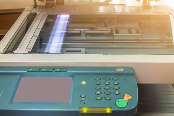 istock photocopier with  luminous sunrise or sunset 1049137612