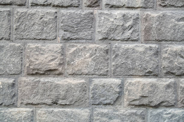 istock New wall of gray stone closeup 1049142796