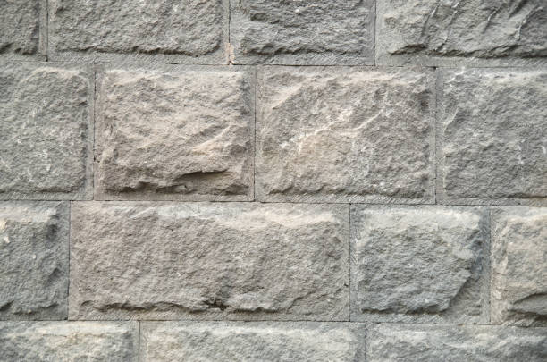 istock New wall of gray stone closeup 1049142822