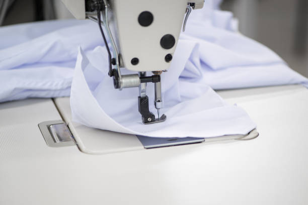 istock workshop in sewing shirts in a textile factory 1049160460
