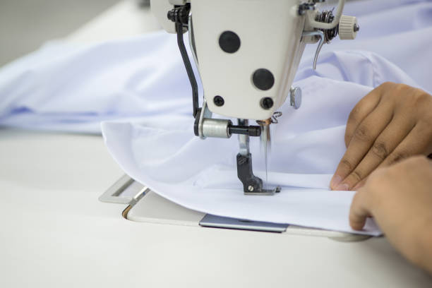 istock workshop in sewing shirts in a textile factory 1049160842