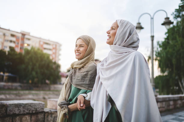 istock Arabic students having a walk together holding hands 1049163046