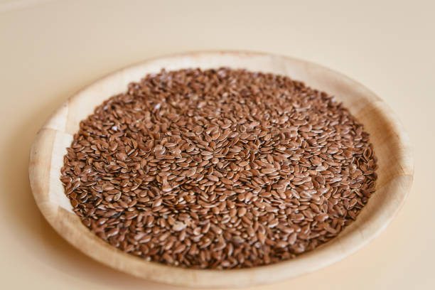 istock brown flax seeds on wooden plate 1049164166
