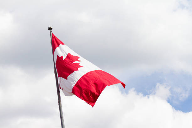 istock Canadian Flag blowing in the wind 1049168884