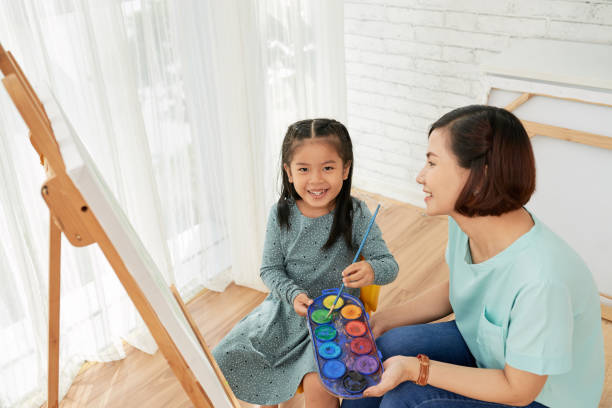 istock Joyful girl attending art class 1049171754