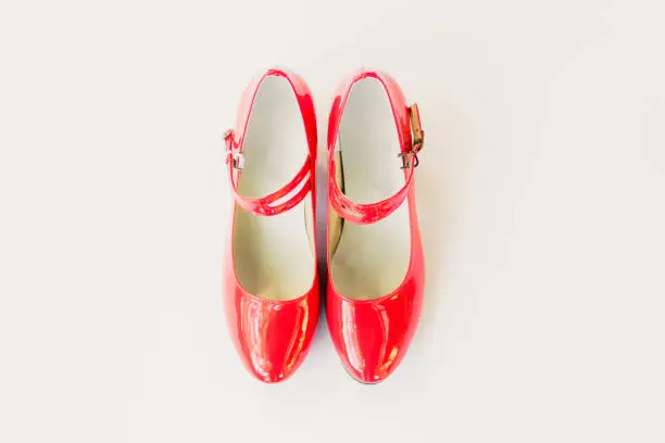 Red shoes with buckle on white background