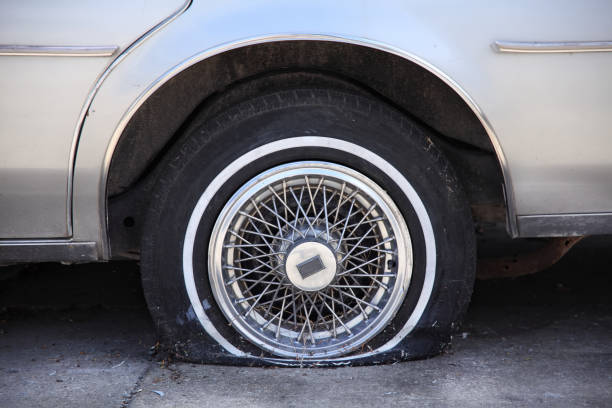 istock Close up broken car tire 1049177916