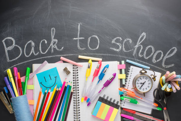 istock Text Back To School Chalk Drawing Elements on Blackboard Background School Supplies Education Concept 1049180034