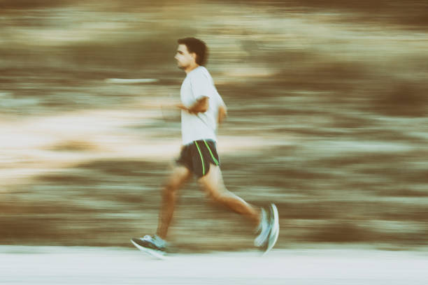 istock Male athlete runner running fast. Motion blur effect. 1049183444