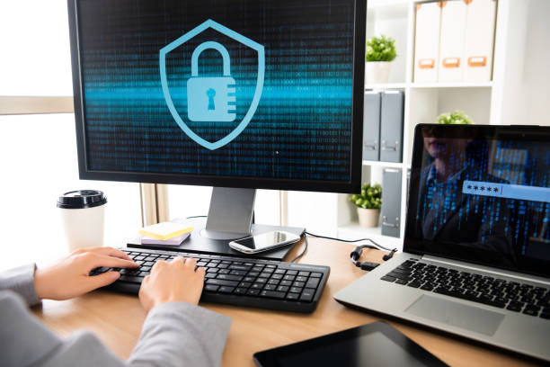 female employee trying to unlock her computer - employee theft imagens e fotografias de stock