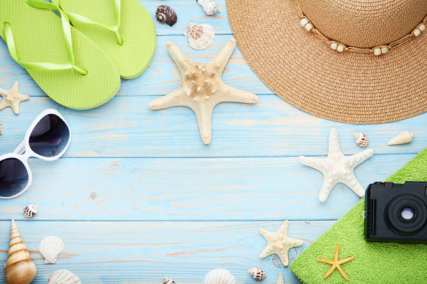 istock Summer accessories with seashells on wooden table 1049189122