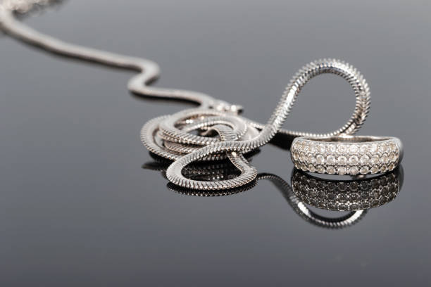 istock Unusual beautiful silver chain and a silver ring with gems 1049189676