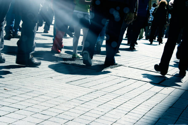 istock Close up people walking on busy street 1049189738
