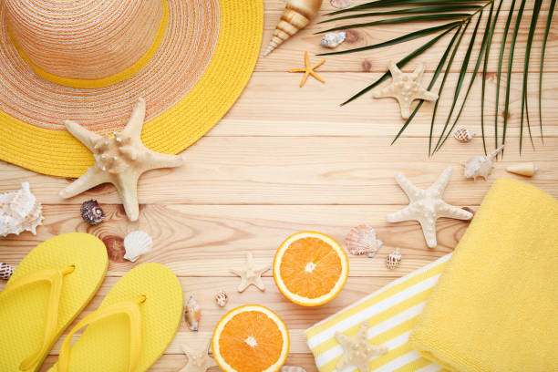 istock Summer accessories with seashells on brown wooden table 1049192382