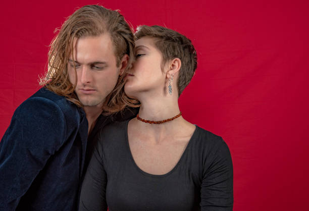 istock Young affectionate couple .She whispers in his ear. 1049197898