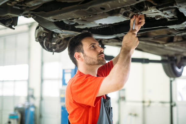 istock Auto mechanic working in garage. Repair service. 1049198300