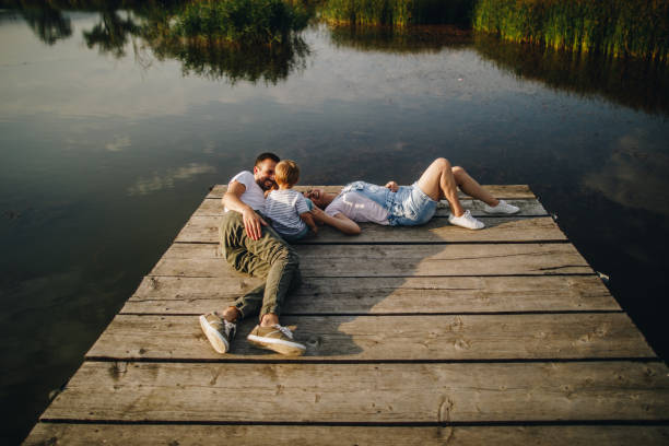 istock Loving family by the lake 1049200896