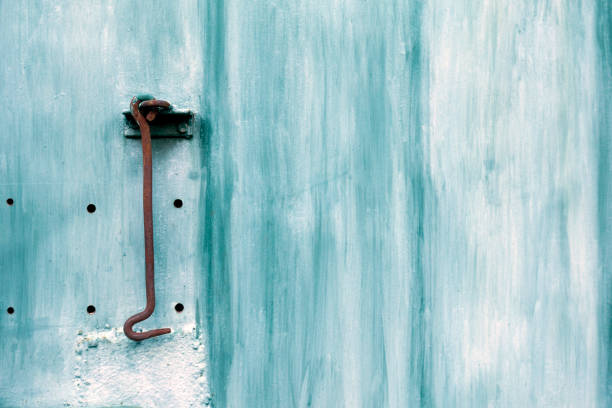 istock Turquoise door with hook. Vintage texture background. Rustic view. 1049201660