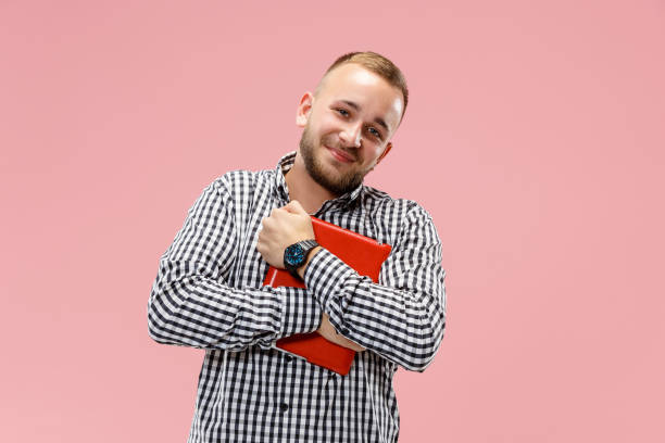 istock Businessman hugging laptop 1049201956