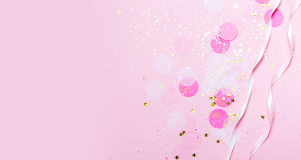 istock Pink confetti and stars and sparkles on pink background. 1049203776