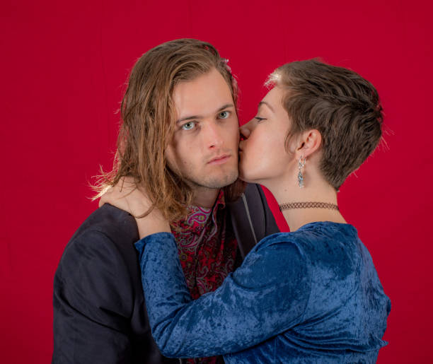 Young affectionate couple enjoying a kiss.