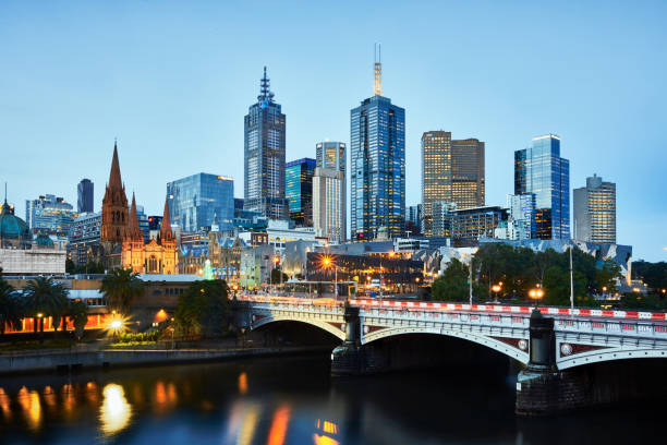 Melbourne waterfront cityscape at twilight. Melbourne waterfront cityscape at twilight. With view of St. Paul's Cathedral and the river.
Long time exposure at dusk. melbourne australia stock pictures, royalty-free photos & images