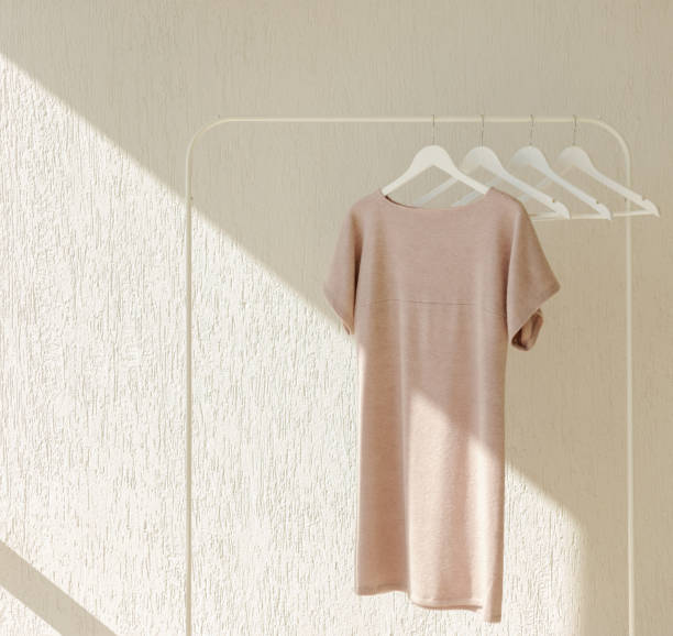 istock White row of hangers on the rack. 1049214404