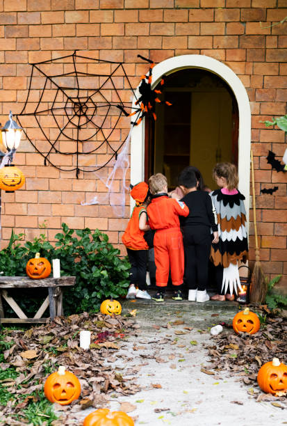 istock Little children trick or treating on Halloween 1049214710