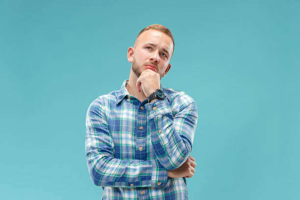 istock Young serious thoughtful businessman. Doubt concept. 1049217032