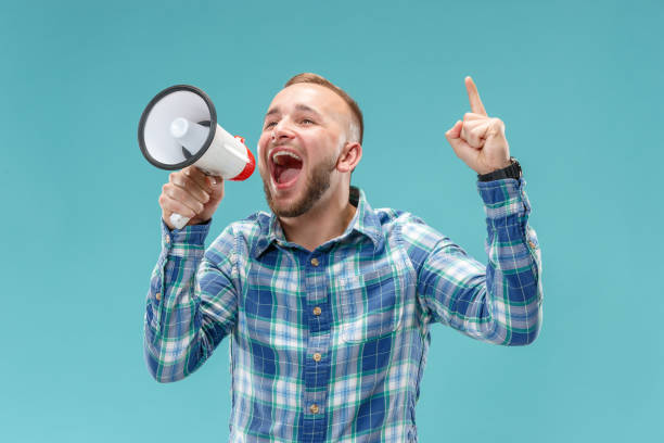 istock man making announcement with megaphone 1049217130