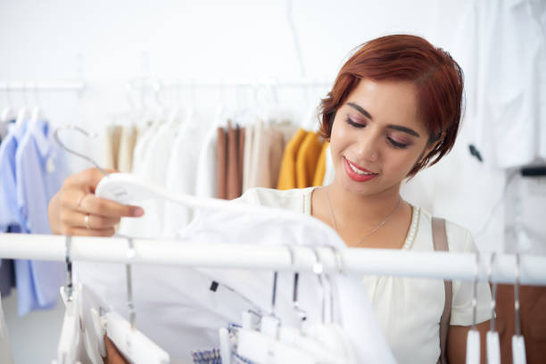 istock Pretty girl buying clothes 1049217220