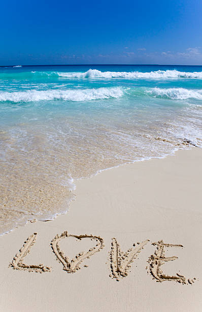istock On  oceanside's sand  word is written "love" 104921927