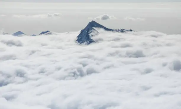 Mountain peak covered in think fog in Saas-Fee, Switzerland.