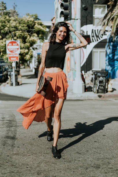 istock Cool woman with a longboard 1049220504