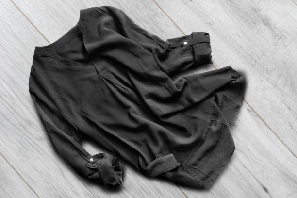 istock Blouse on wooden floor 1049222970