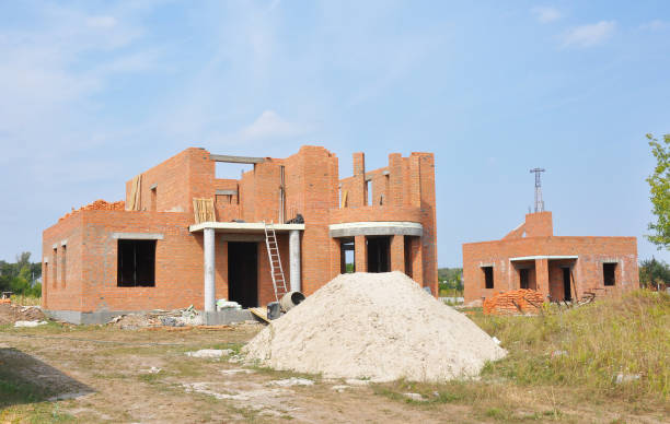 istock Building residential construction house  from bricks. Unfinished House Construction. 1049223860