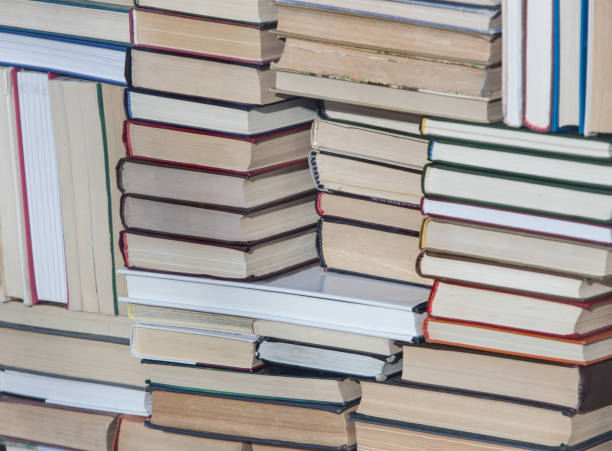 istock Stack of chaotically stacked books. Close-up. 1049223982