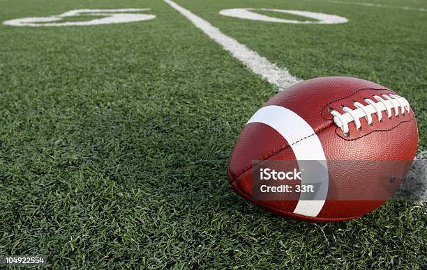 American Football With The Fifty Beyond Stock Photo - Download Image Now - American Football - Ball, American Football - Sport, American Football Field