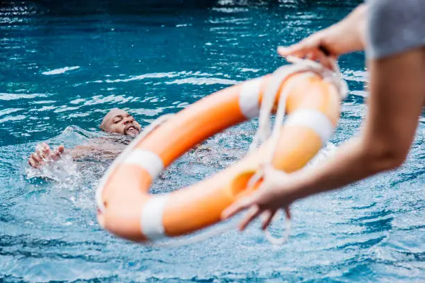 Photo of Man being rescued from the water