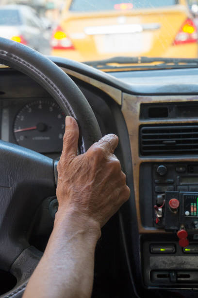 istock the hands of a veteran driver 1049230742