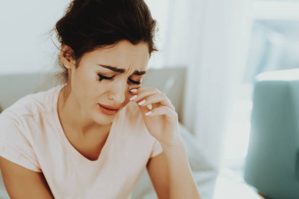 istock Lonely Woman Crying Alone With Flowed Mascara. 1049230826
