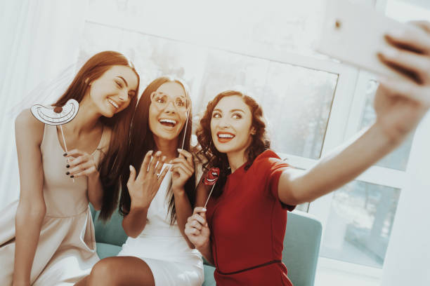 istock Smiling Girls Are Doing Selfie On A Hen-party. 1049231114