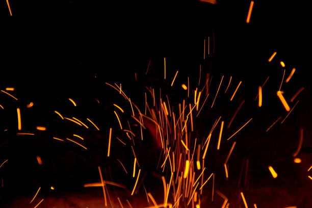 istock Fire sparks in the air near the fireplace 1049241496