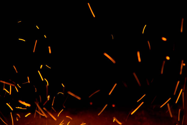 Fire sparks in the air near the fireplace blured
